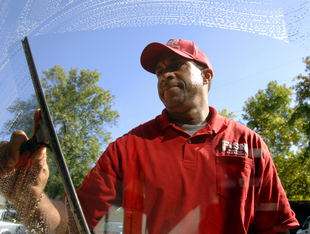 Cleaning can be done with a mop and squeegee or with a water-fed pole