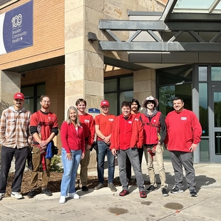 owner jason rowsell with fish window cleaning team