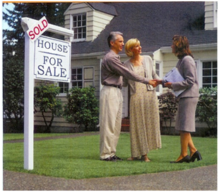 Couple with Agent and Sold Sign