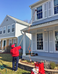 Fish Window Cleaner Using Water-Fed Pole on 2-Story Sterling Home