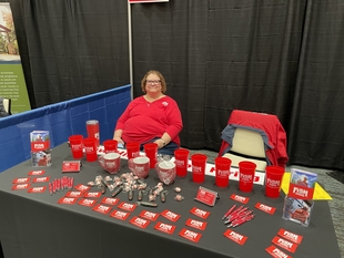 owner julie worsham at their fish window cleaning booth