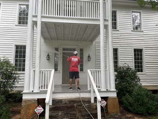 window cleaner powerhosing condo building