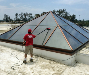 window cleaner cleaning a big skylight
