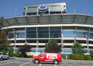red fish window cleaning van parked in front of penn state stadium