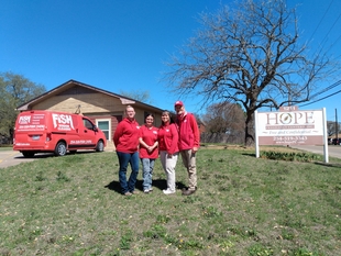 fish window cleaning employees standing in front of HOPE PC, INC