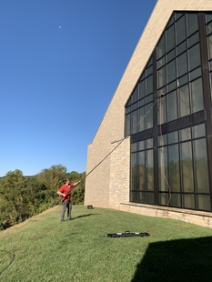 Image of Window Cleaner Cleaning Windows of Local Church