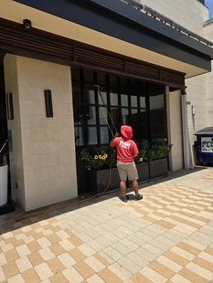window cleaner cleaning windows of a building