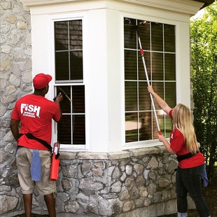 Two FISH Window Cleaners Cleaning Home Window