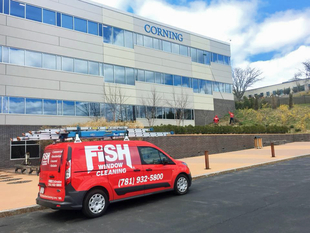 Image of Fish Window Cleaning Van Outside 3-Story Boston Business Building