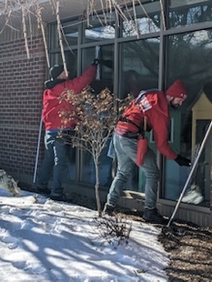 Two FISH Window Cleaners Cleaning Butler County Humane Society Windows