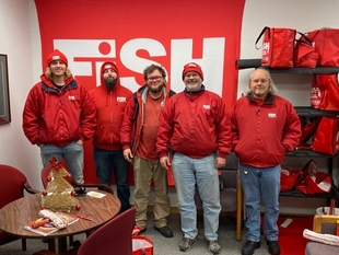 five fish employees taking a picture together