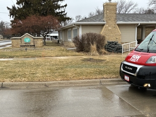 fish window cleaning van parked next to hospice home