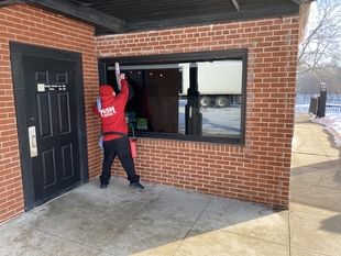 window cleaner cleaning windows of building