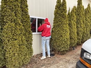 window cleaner cleaning windows of building
