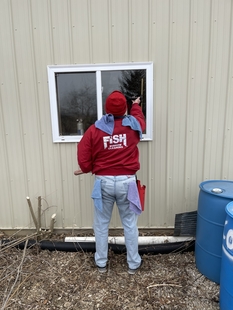window cleaner cleaning windows of building