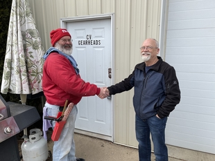 window cleaner shaking hands with man