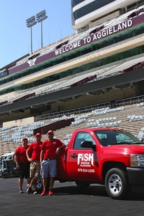Image of Fish Window Cleaning Team with Logo'd Truck in Texas A&M Stadium