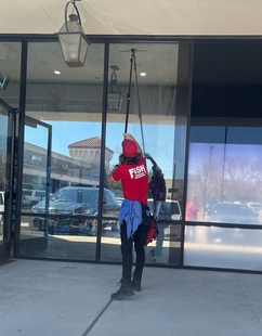 FISH Window Cleaner Using Pole to Clean Storefront Windows