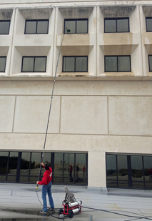 Image of Window Cleaner Cleaning 3rd Story Windows with Water-Fed Pole