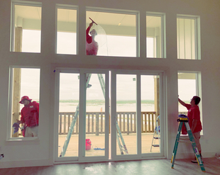 Image of 3 FISH Window Cleaners Cleaning Windows Overlooking Beach