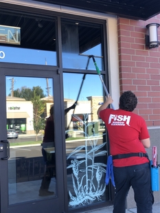 Image of Window Cleaner Cleaning Corvallis Storefront Windows
