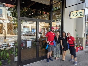 two window cleaners posing with owners/employees at klara haloho