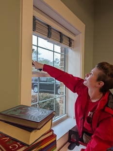 Fish Window Cleaner Cleaning Interior of Children in Crisis Window