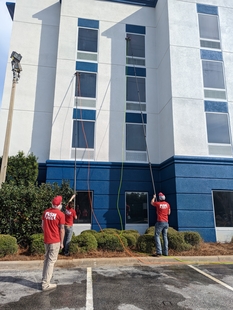 FISH Window Cleaners Using Water-Fed Poles to Clean 3rd and 4th Story Windows