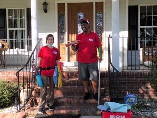 Image of Two FISH Window Cleaners Standing on Porch