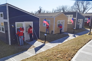 Fish Window Cleaners Cleaning Homes at the Veterans Community Project