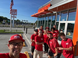 selfie of the fish team in front of a whattaburger