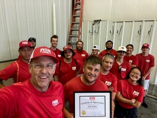 selfie of the fish team holding an award