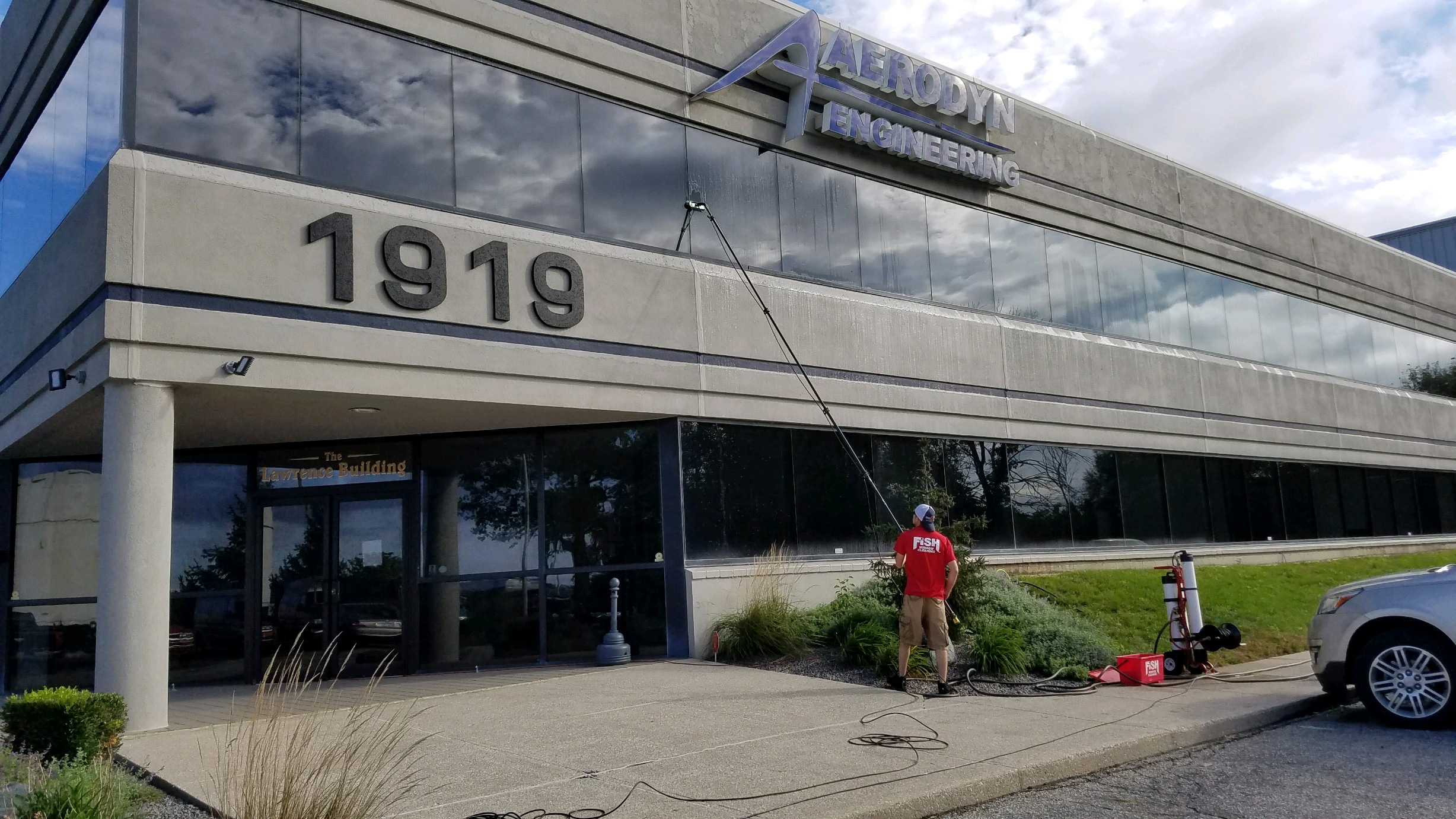 Fish Window Cleaner Cleans 2nd Story Office Building Windows with a Water-Fed Pole
