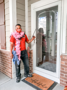 Fish Window Cleaner Wearing Pink Feather Boa Cleaning Glass Door with a Squeegee