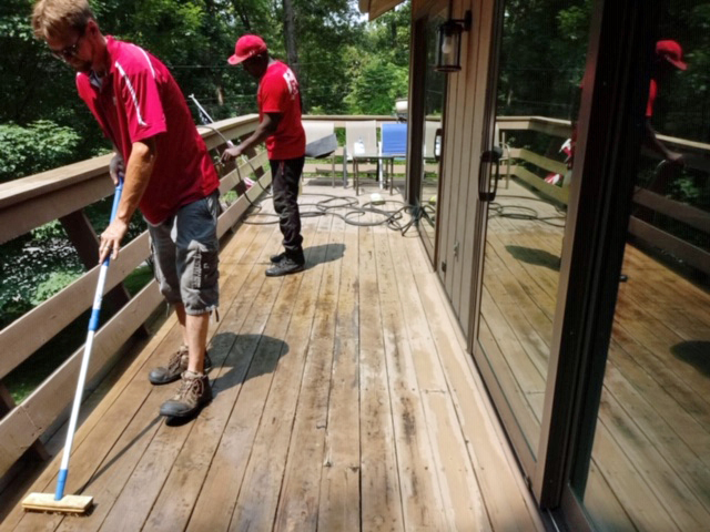 Image of Fish Window Cleaners Cleaning Wood Deck