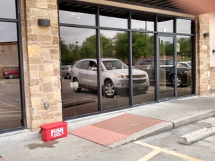 Storefront Windows with FISH Branded Bucket in Front