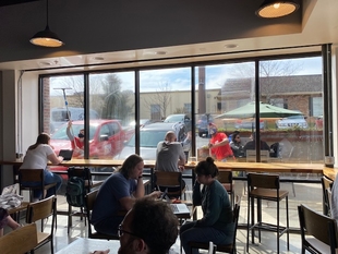 Two Window Cleaners Clean Restaurant Windows