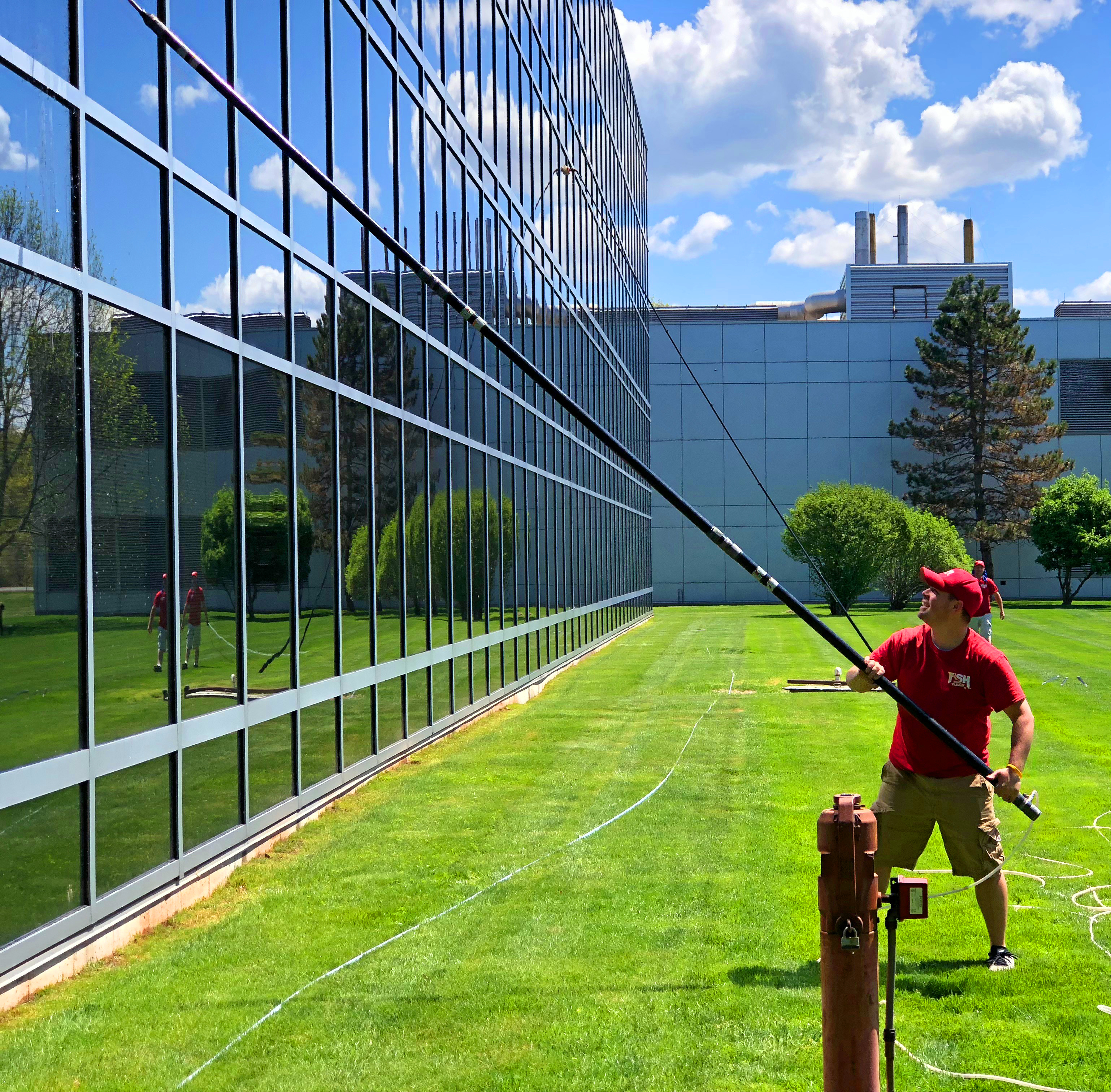 Fish Window Cleaner Cleaning Multi-Story Windows with a Pole