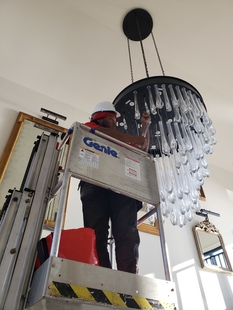 window cleaner cleaning fancy chandelier