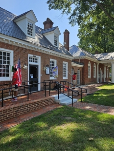two window cleaners cleaning windows of building