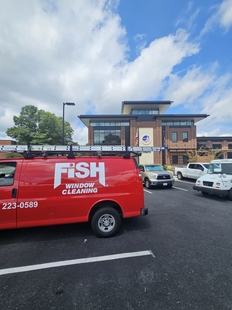 fish window cleaning van parked in front of new fire department building