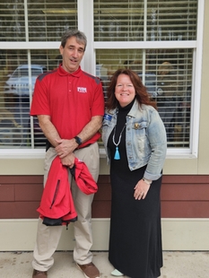 fish employee posing with a woman