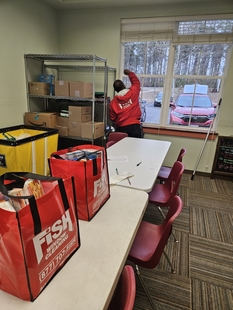 window cleaner cleaning a window of a building indoors