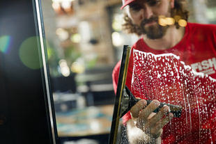 Image of Fish Window Cleaner Cleaning Window with Squeegee
