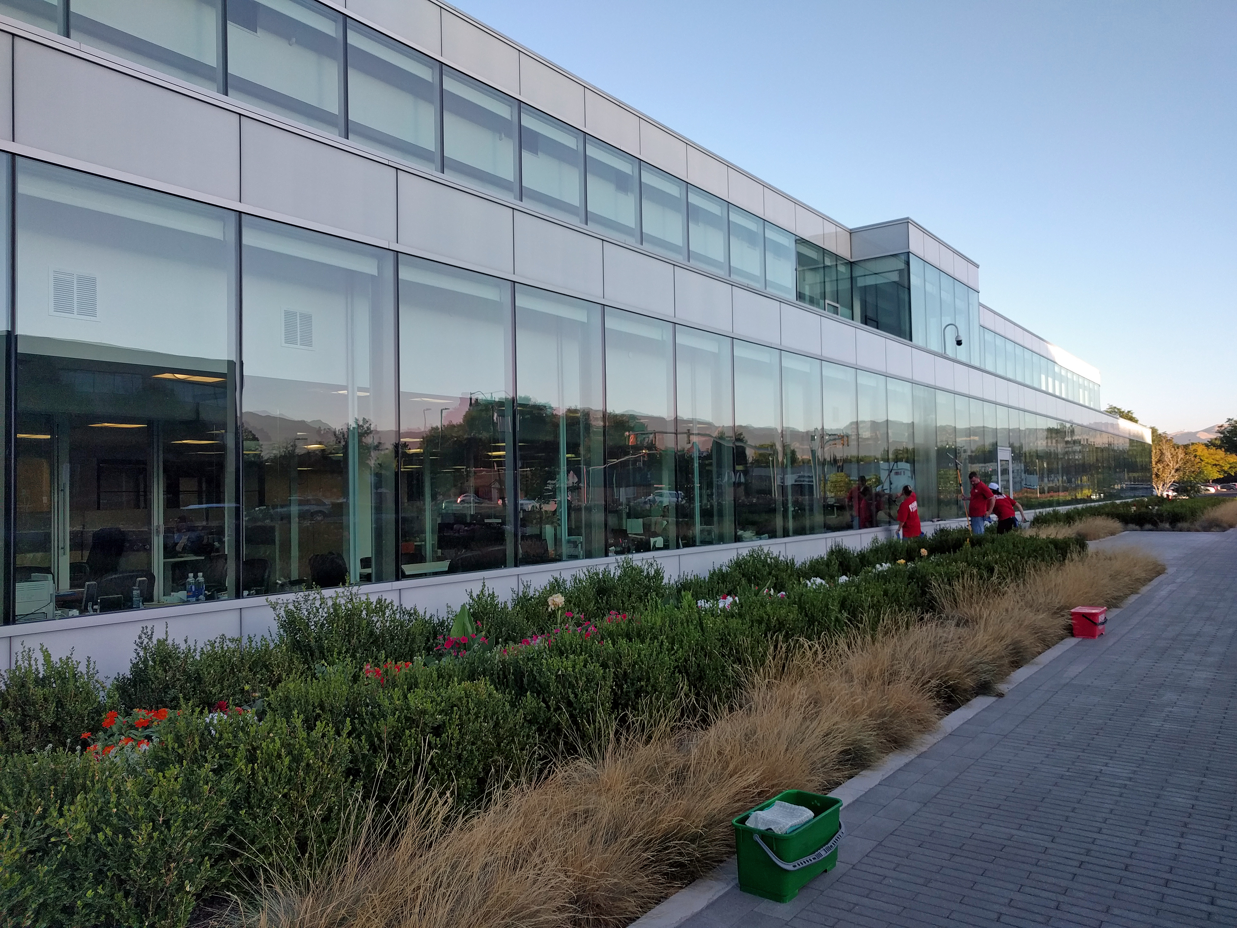 Fish Window Cleaners Cleaning Exterior Of 2-Story Office