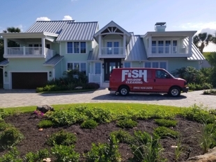 Large 2-Story Home in Sarasota with Fish Window Cleaning Branded Van in Front
