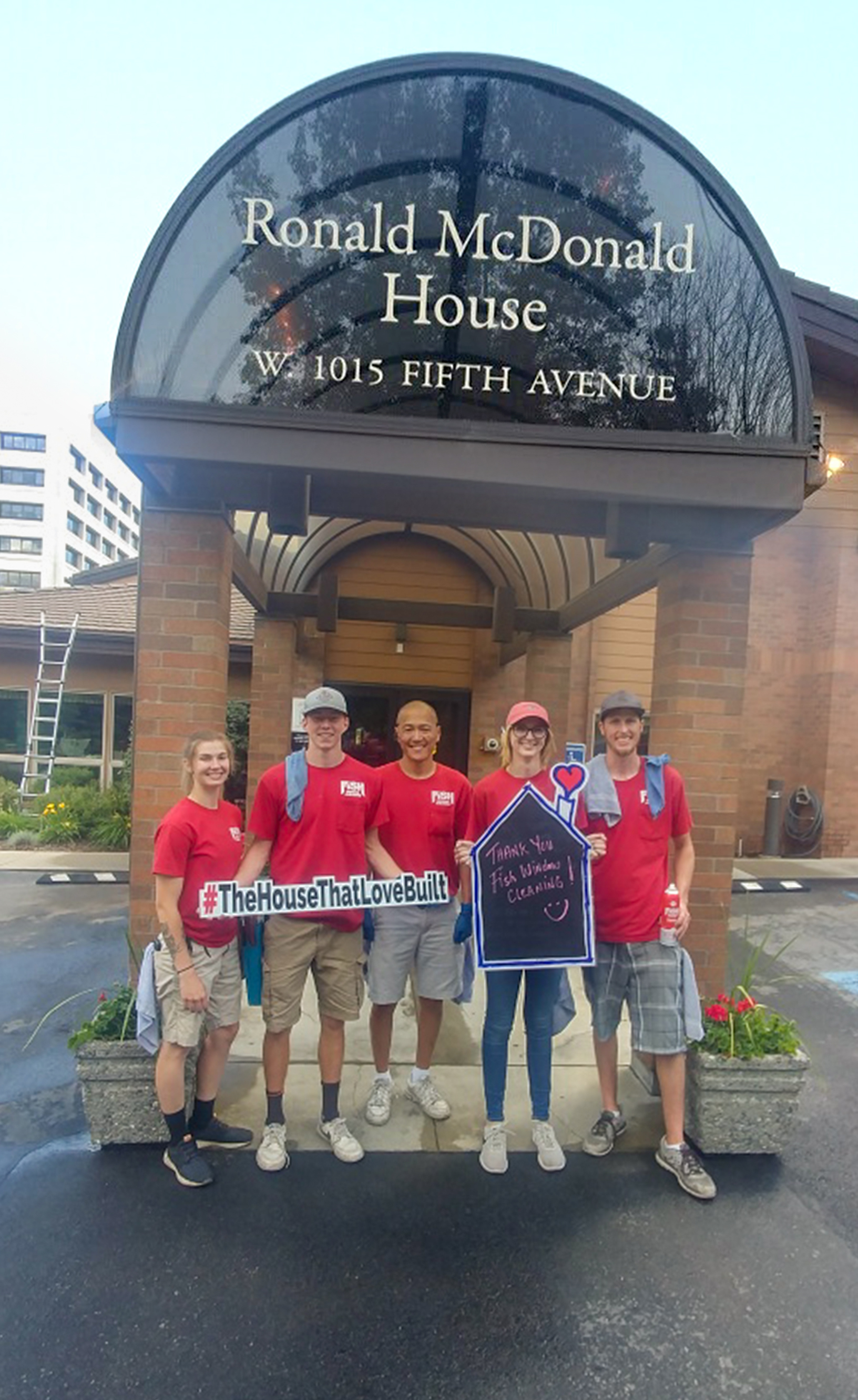 Five Fish Window Cleaning Team Members in Front of Ronald McDonald House