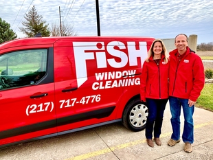 Sean and Holly Middleton, Owners, in Front of Branded Van
