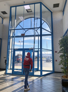 Window Cleaner Using Pole to Clean 2 Story Foyer Windows