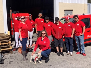 owner cole robinson posing with some of her employees
